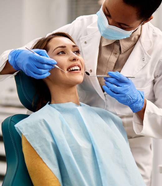 patient getting teeth examed